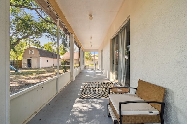 view of patio / terrace with an outbuilding