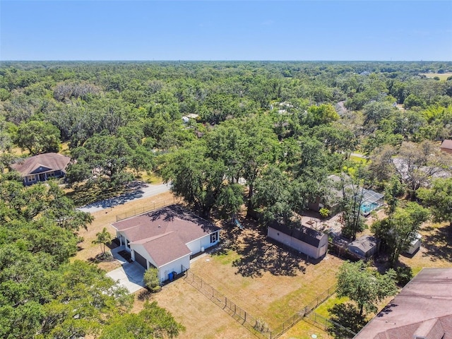 bird's eye view featuring a wooded view