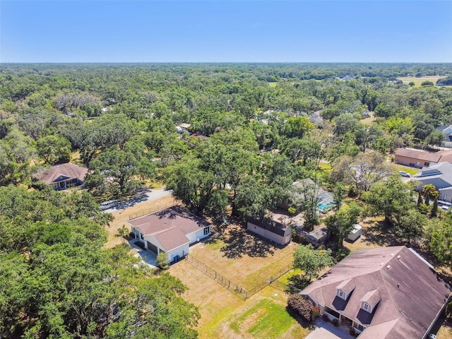 bird's eye view featuring a wooded view