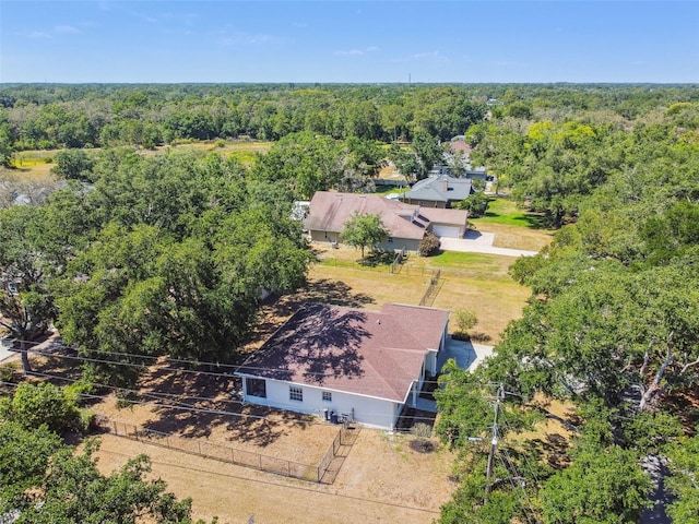 birds eye view of property with a wooded view