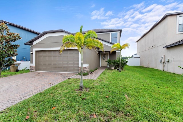 11871 Crestridge Loop, Trinity, FL 34655 - view of front of property with an attached garage, decorative driveway, stucco siding, and a front yard