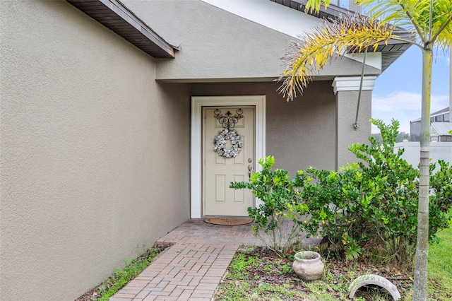 11871 Crestridge Loop, Trinity, FL 34655 - property entrance with stucco siding