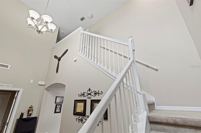 11871 Crestridge Loop, Trinity, FL 34655 - stairs featuring arched walkways, visible vents, carpet floors, and a towering ceiling
