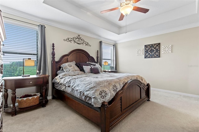 11871 Crestridge Loop, Trinity, FL 34655 - carpeted bedroom featuring crown molding, a tray ceiling, ceiling fan, and baseboards