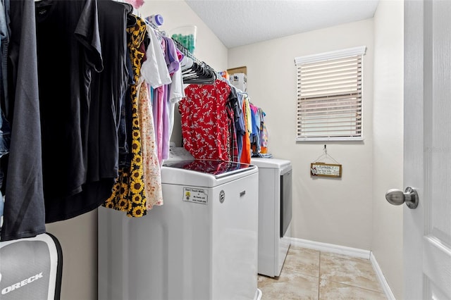 11871 Crestridge Loop, Trinity, FL 34655 - laundry area with separate washer and dryer, laundry area, light tile patterned floors, and baseboards