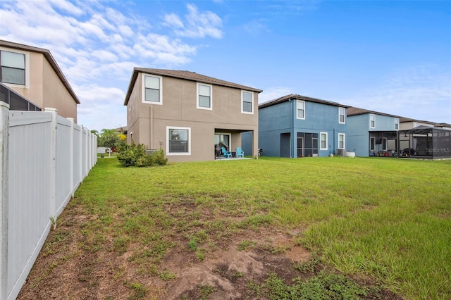 11871 Crestridge Loop, Trinity, FL 34655 - back of house featuring stucco siding, fence, and a yard