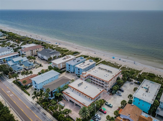 bird's eye view featuring a water view and a view of the beach