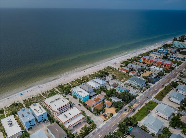 bird's eye view featuring a beach view and a water view