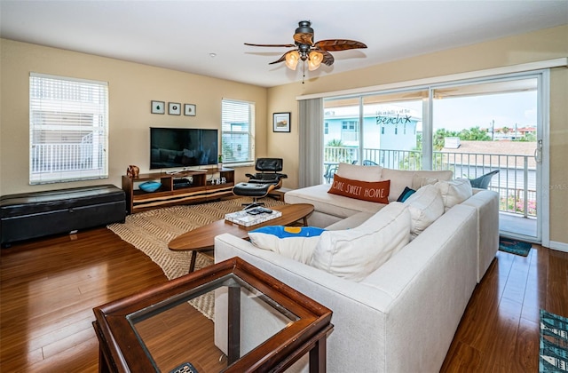 living area featuring ceiling fan and wood finished floors