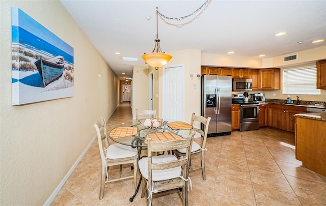 dining space with recessed lighting, baseboards, visible vents, and light tile patterned floors