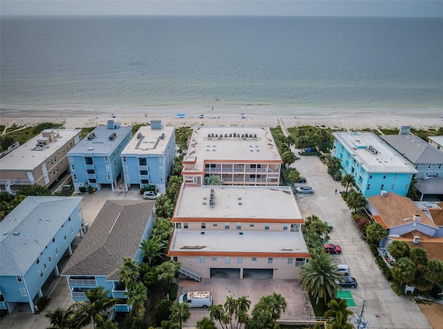 drone / aerial view with a water view and a view of the beach