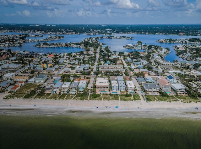 bird's eye view featuring a beach view, a water view, and a residential view