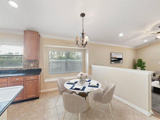 dining room with crown molding, light tile patterned flooring, baseboards, recessed lighting, and ceiling fan with notable chandelier