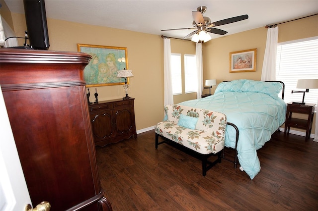 bedroom with baseboards, a ceiling fan, and wood finished floors