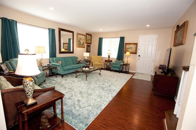 living area with recessed lighting and dark wood finished floors