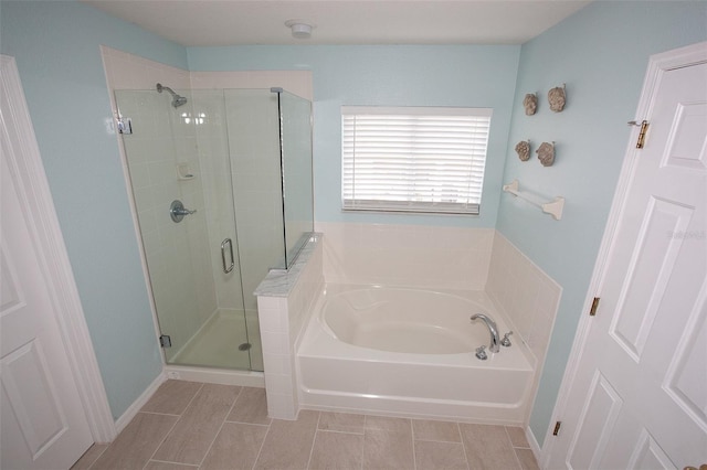 full bathroom featuring a shower stall and a bath