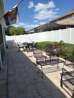 view of patio / terrace with a fenced backyard and outdoor dining space