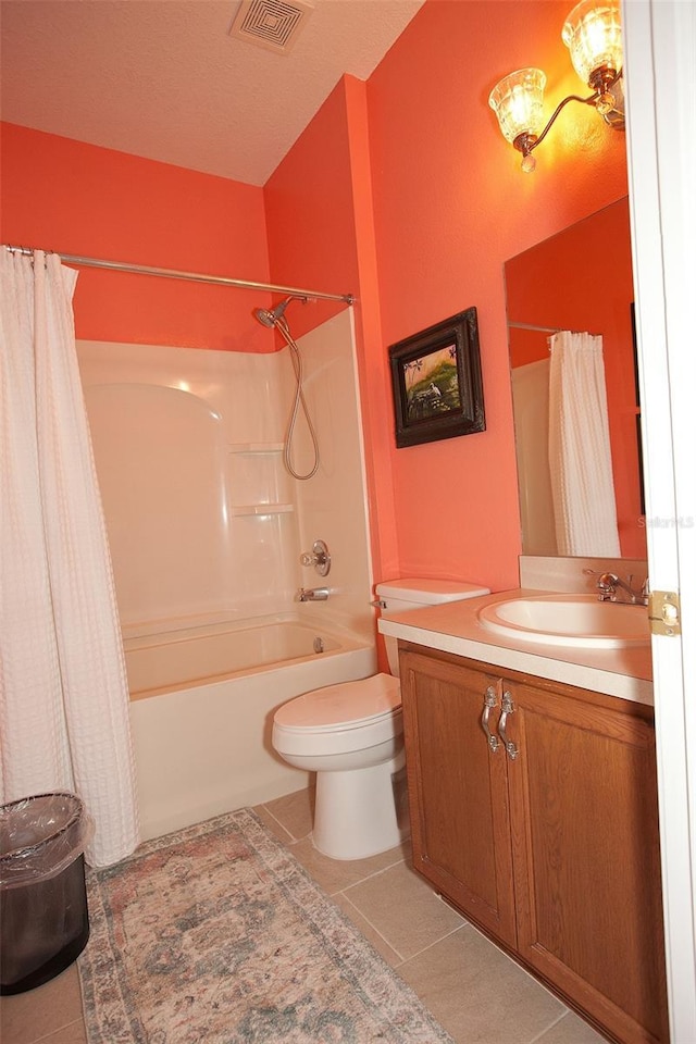 bathroom with vanity, shower / bath combo with shower curtain, tile patterned floors, toilet, and visible vents