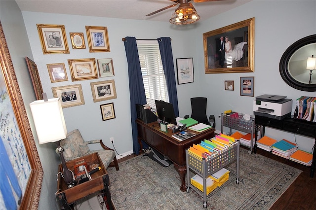 office space with baseboards, a ceiling fan, and wood finished floors