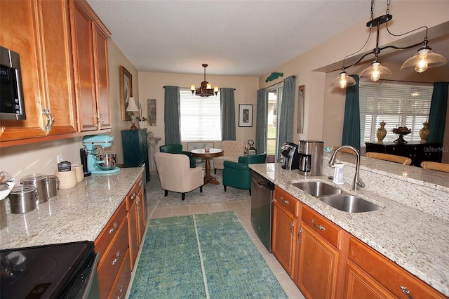 kitchen with a sink, dishwashing machine, light tile patterned floors, and brown cabinets