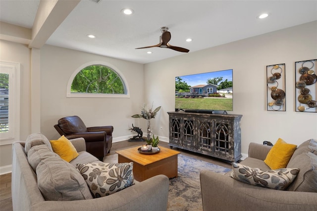 living area featuring wood finished floors, recessed lighting, a ceiling fan, and baseboards