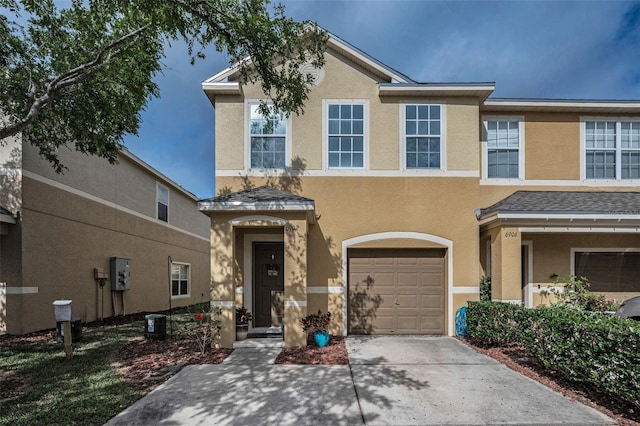 6902 47th Ln N, Pinellas Park, FL 33781 - multi unit property with a garage, stucco siding, concrete driveway, and central AC
