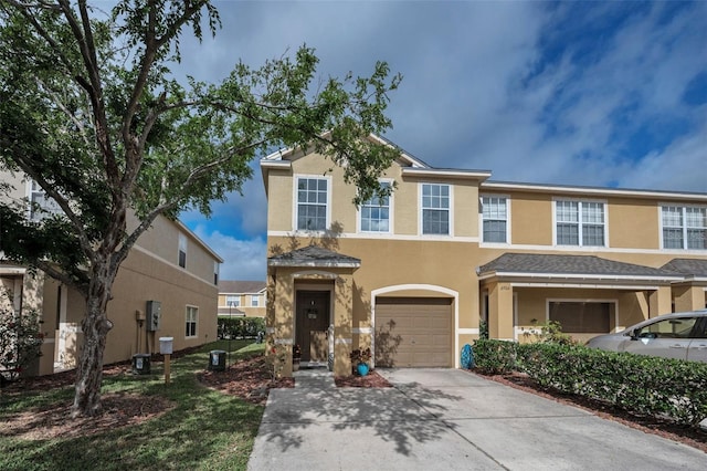 6902 47th Ln N, Pinellas Park, FL 33781 - view of front of property with a garage, stucco siding, and driveway