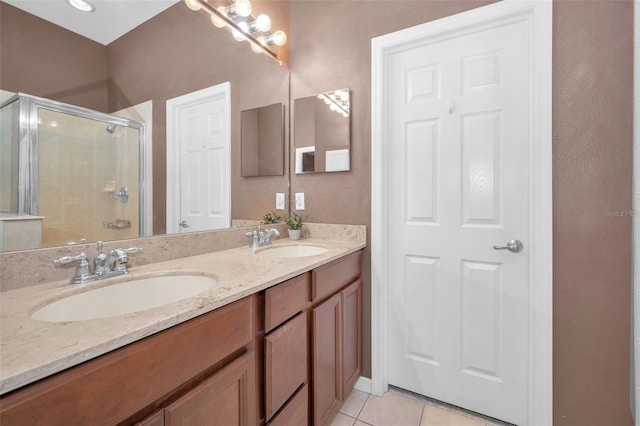 6902 47th Ln N, Pinellas Park, FL 33781 - full bath with tile patterned flooring, a sink, a stall shower, and double vanity