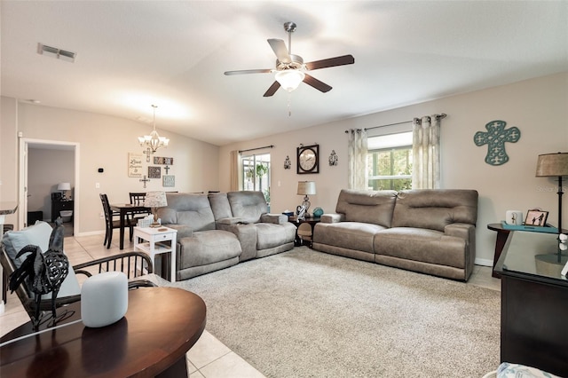 living room with vaulted ceiling, visible vents, light tile patterned flooring, and ceiling fan with notable chandelier