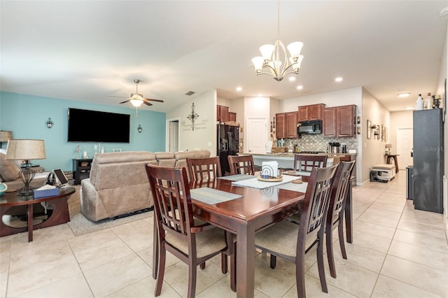 dining room with light tile patterned floors, visible vents, ceiling fan with notable chandelier, and recessed lighting