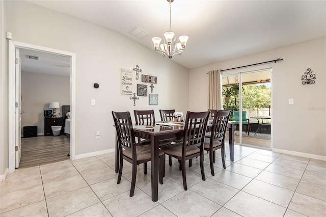 dining room with light tile patterned floors, baseboards, lofted ceiling, and a notable chandelier