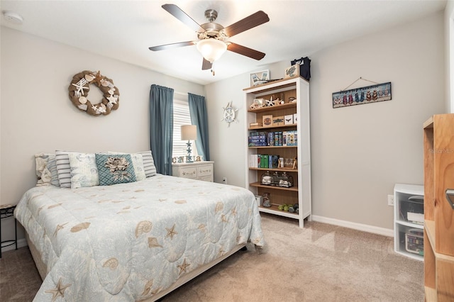 bedroom featuring ceiling fan, carpet, and baseboards