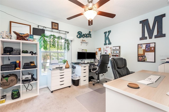 office area with baseboards and a ceiling fan