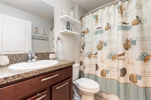 full bathroom featuring toilet, vanity, and a shower with curtain