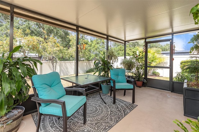 sunroom with outdoor dining space