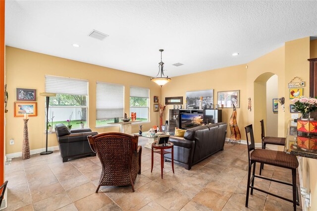 11845 Newberry Grove Loop, Riverview, FL 33579 - living area with arched walkways, plenty of natural light, recessed lighting, and baseboards