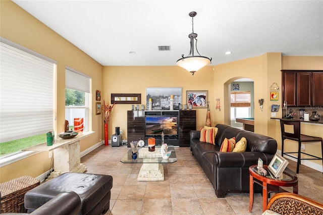 11845 Newberry Grove Loop, Riverview, FL 33579 - living room with arched walkways, recessed lighting, and baseboards