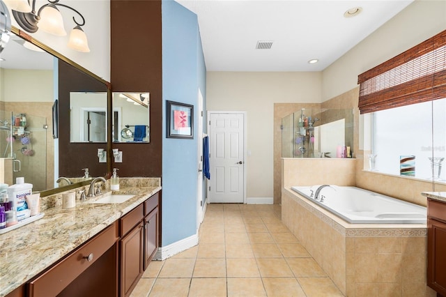 11845 Newberry Grove Loop, Riverview, FL 33579 - full bath with vanity, a shower stall, and a garden tub