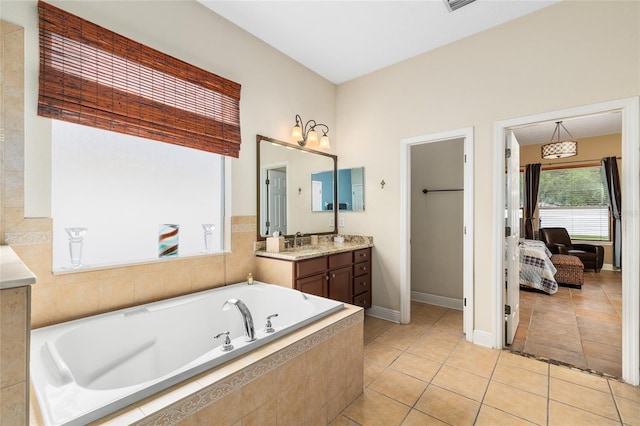 11845 Newberry Grove Loop, Riverview, FL 33579 - full bath featuring a bath, vanity, ensuite bath, tile patterned flooring, and baseboards