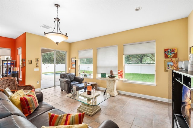 11845 Newberry Grove Loop, Riverview, FL 33579 - living room with baseboards, healthy amount of natural light, and light tile patterned flooring