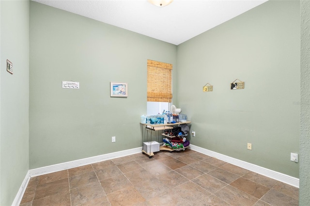 11845 Newberry Grove Loop, Riverview, FL 33579 - laundry room featuring baseboards and stone finish floors