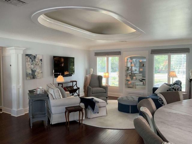 209 Rosery Rd, Belleair, FL 33756 - living room with a raised ceiling, crown molding, dark wood-style floors, and baseboards