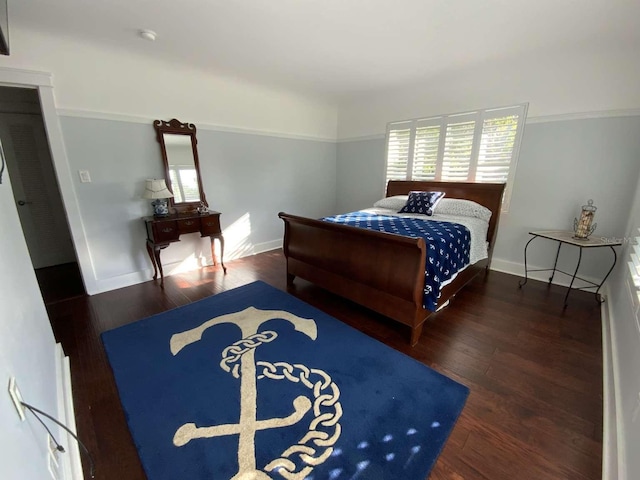 209 Rosery Rd, Belleair, FL 33756 - bedroom featuring wood finished floors and baseboards