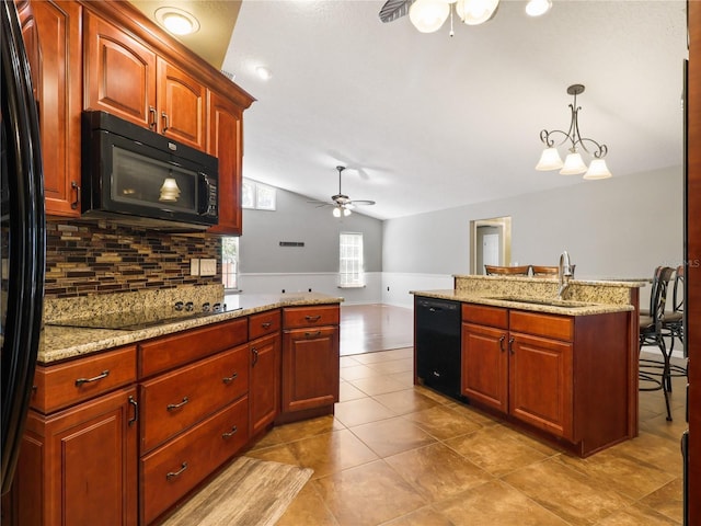 kitchen with a sink, lofted ceiling, black appliances, ceiling fan, and backsplash