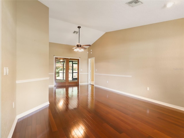 spare room with visible vents, baseboards, a ceiling fan, and hardwood / wood-style floors