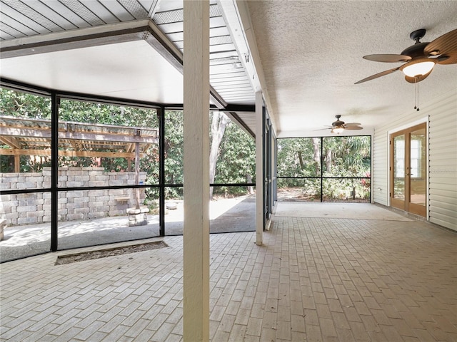view of patio with fence and a ceiling fan