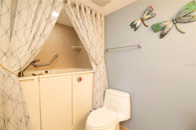 full bath featuring toilet and curtained shower