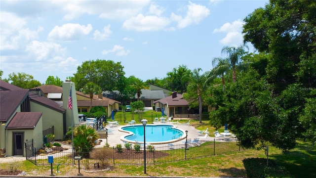 view of pool featuring a patio area and a residential view