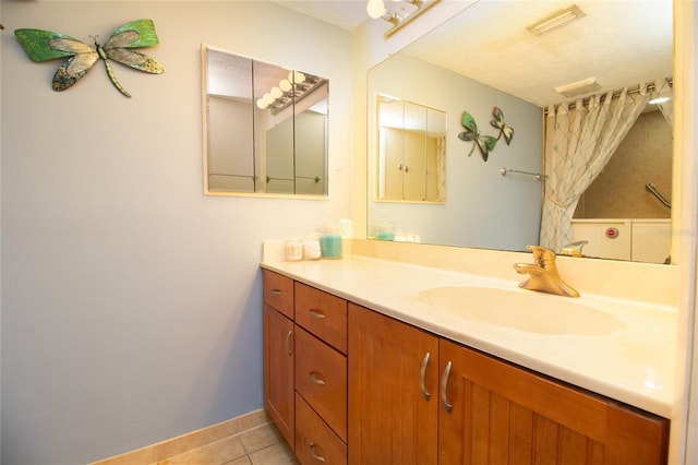 bathroom featuring vanity and tile patterned flooring