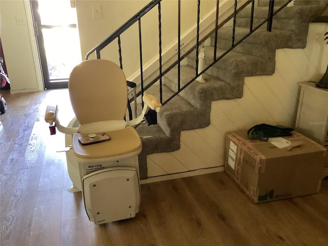 staircase with wood finished floors